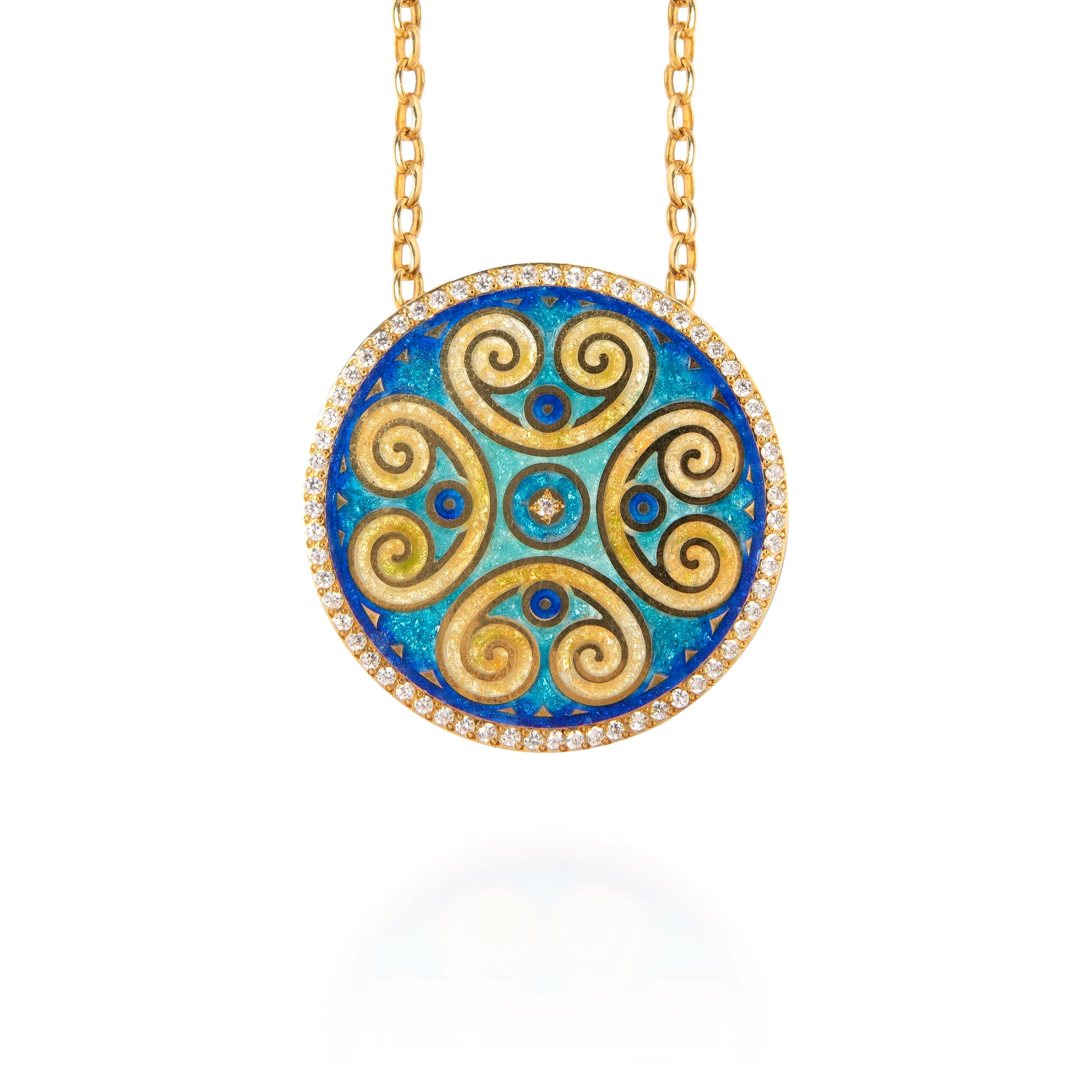 Gold and blue circular pendant necklace on a white background