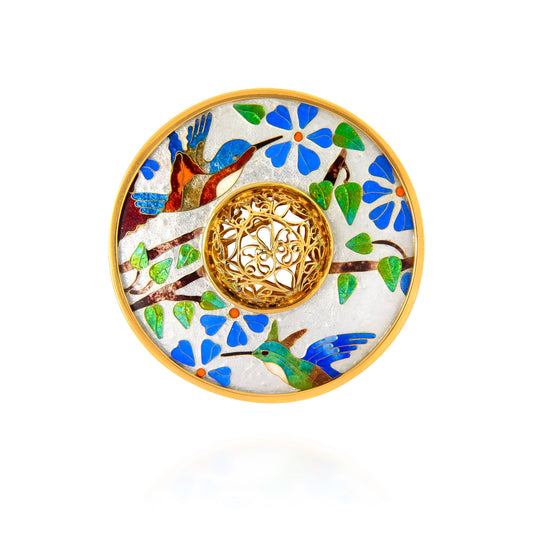 Decorative plate with artistic design of birds, flowers, and a tree of life on a white background