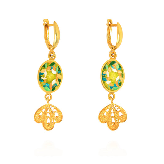 Gold earrings with floral design on a white background